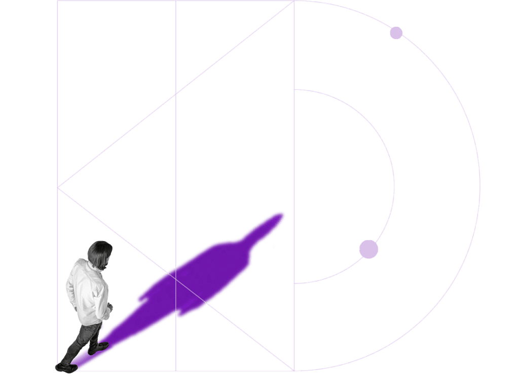 Person walking forward with a long shadow, representing growth