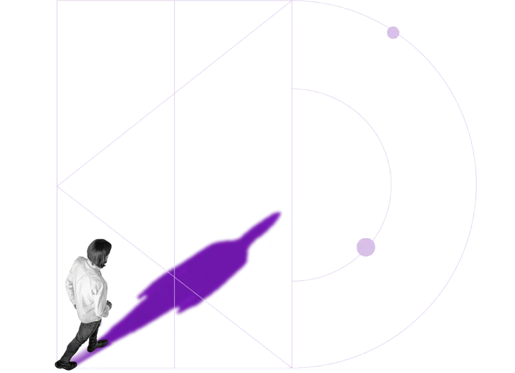 Person walking forward with a long shadow, representing growth
